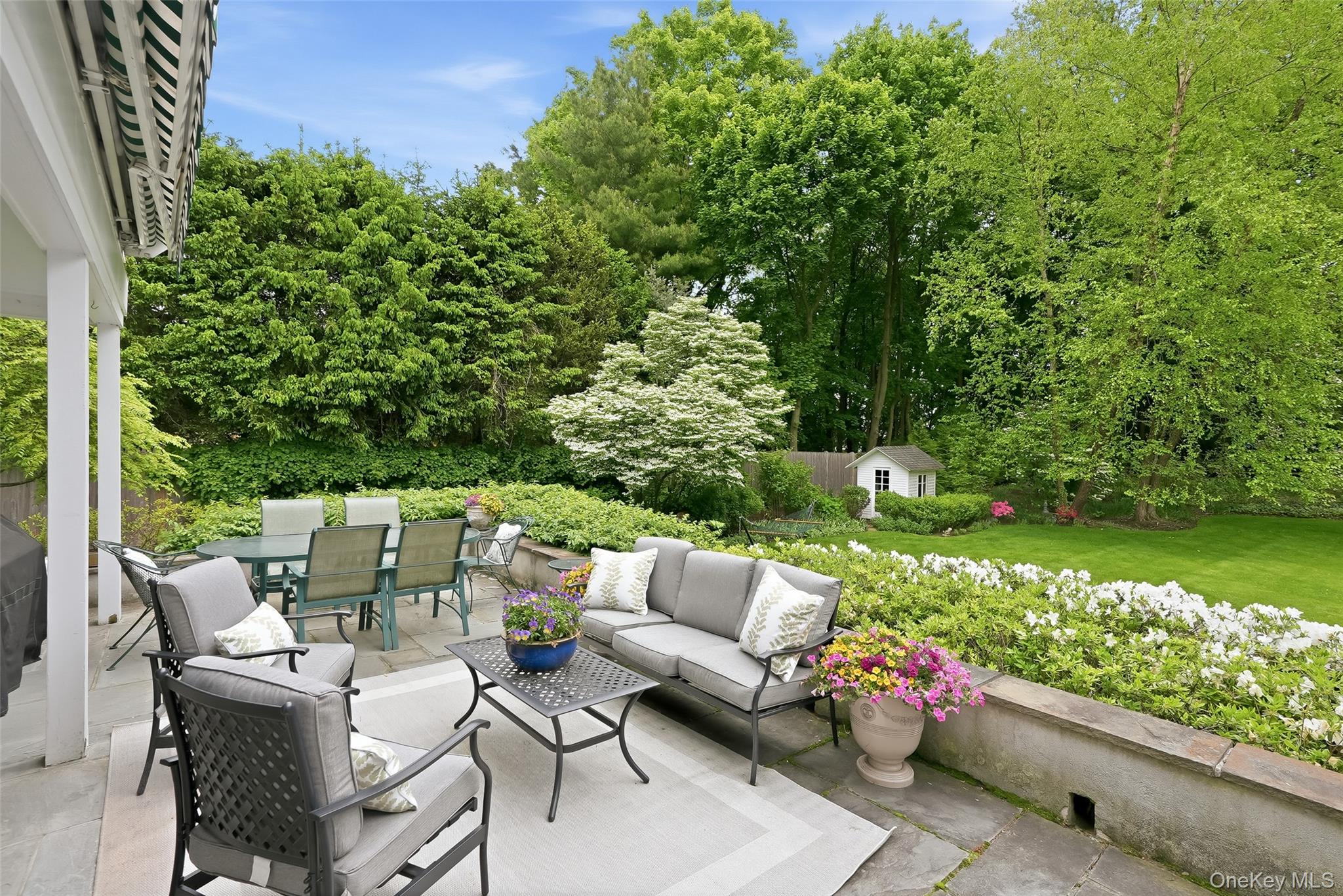 164 Julian Street Rye, NY 10580 - Photo 2 of 38 a view of a patio with couches table and chairs and potted plants