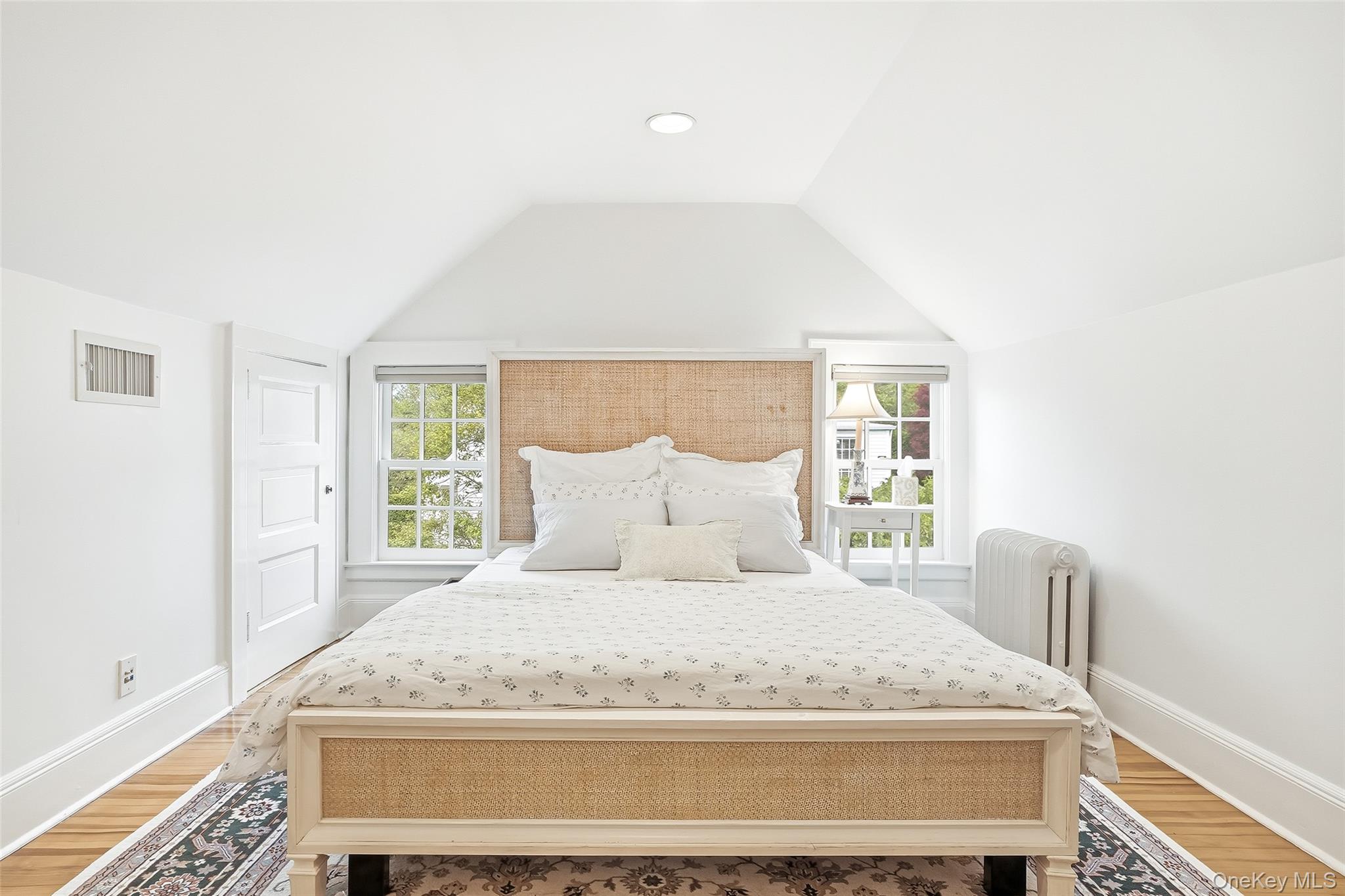 164 Julian Street Rye, NY 10580 - Photo 30 of 38 a large bed sitting in a bedroom next to a window