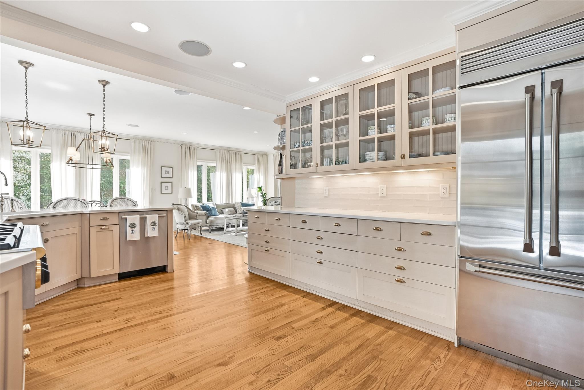 164 Julian Street Rye, NY 10580 - Photo 6 of 38 a large kitchen with kitchen island a counter space a sink stainless steel appliances and cabinets