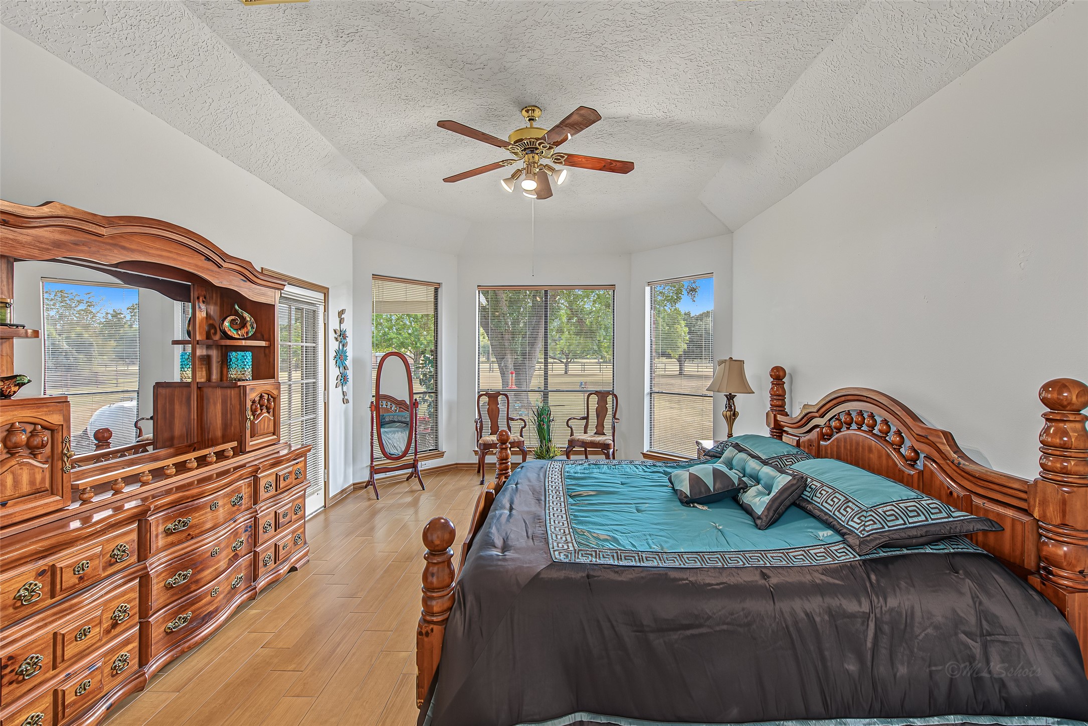 1345 Peach Ridge Road Brookshire, TX 77423 - Photo 29 of 50 A surrounding bay window design creates a bright sitting nook with serene views of the green outdoor landscape, complemented by a multi-pane glass door providing direct access to the back patio.