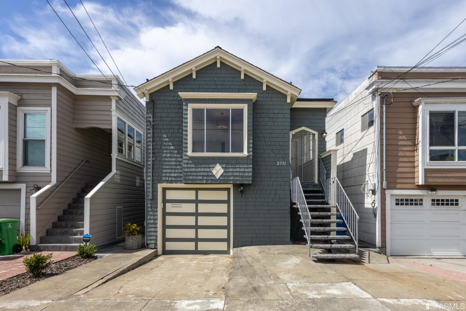 a front view of a house with stairs