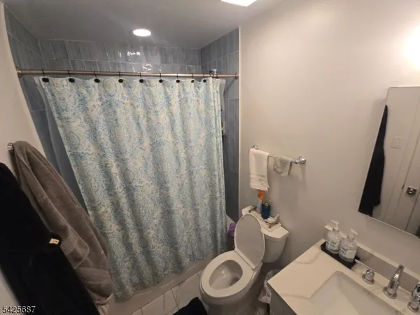a bathroom with a sink and toilet