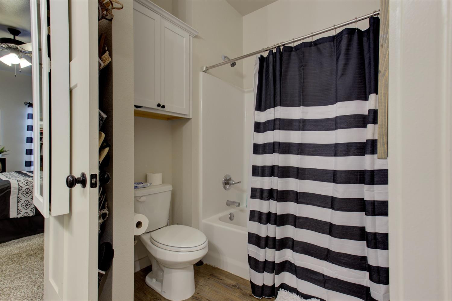2721 137th Street Lubbock, TX 79423 - Photo 21 of 30 a bathroom with a toilet and a shower