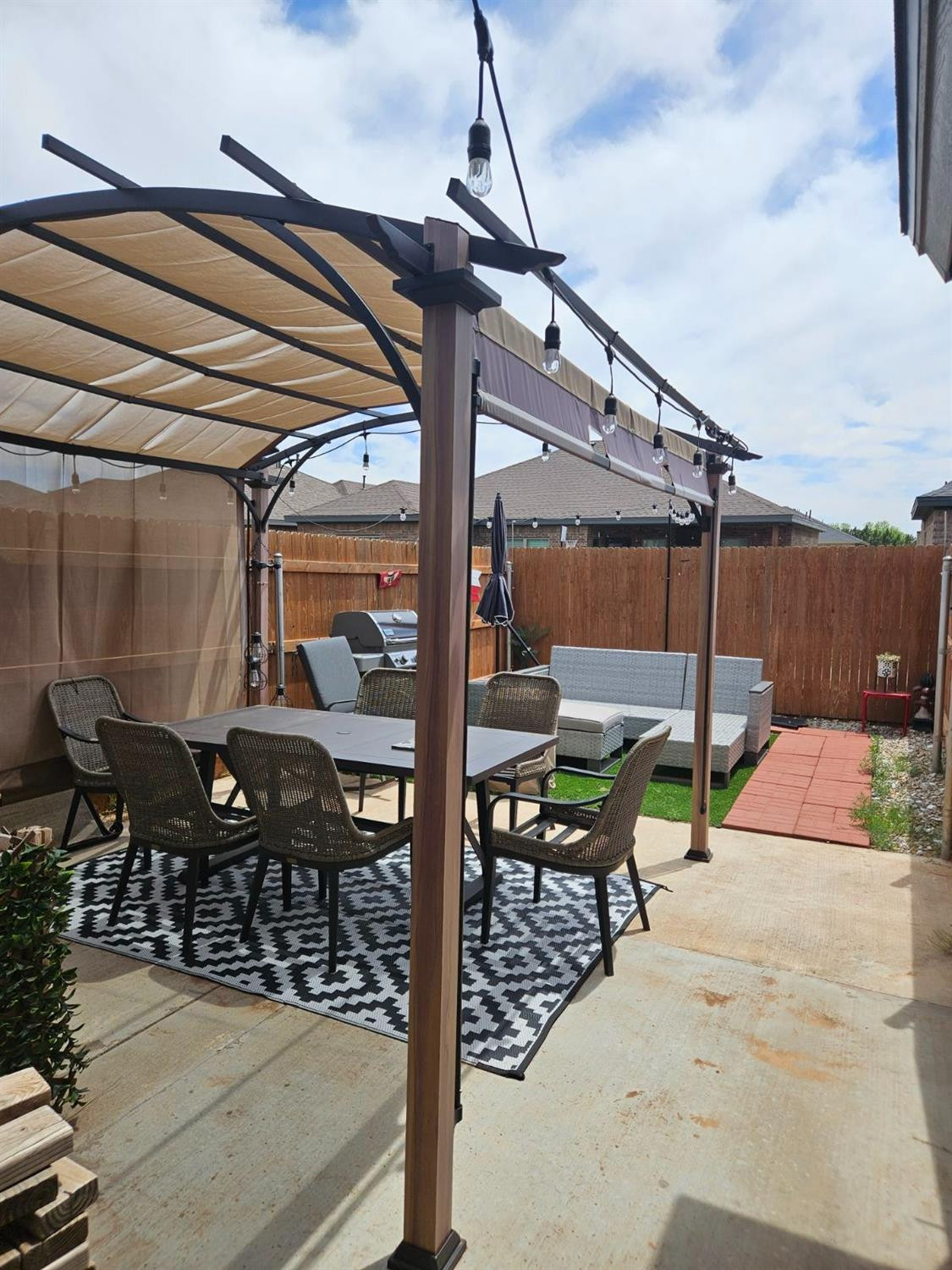 2721 137th Street Lubbock, TX 79423 - Photo 29 of 30 a view of a patio with table and chairs