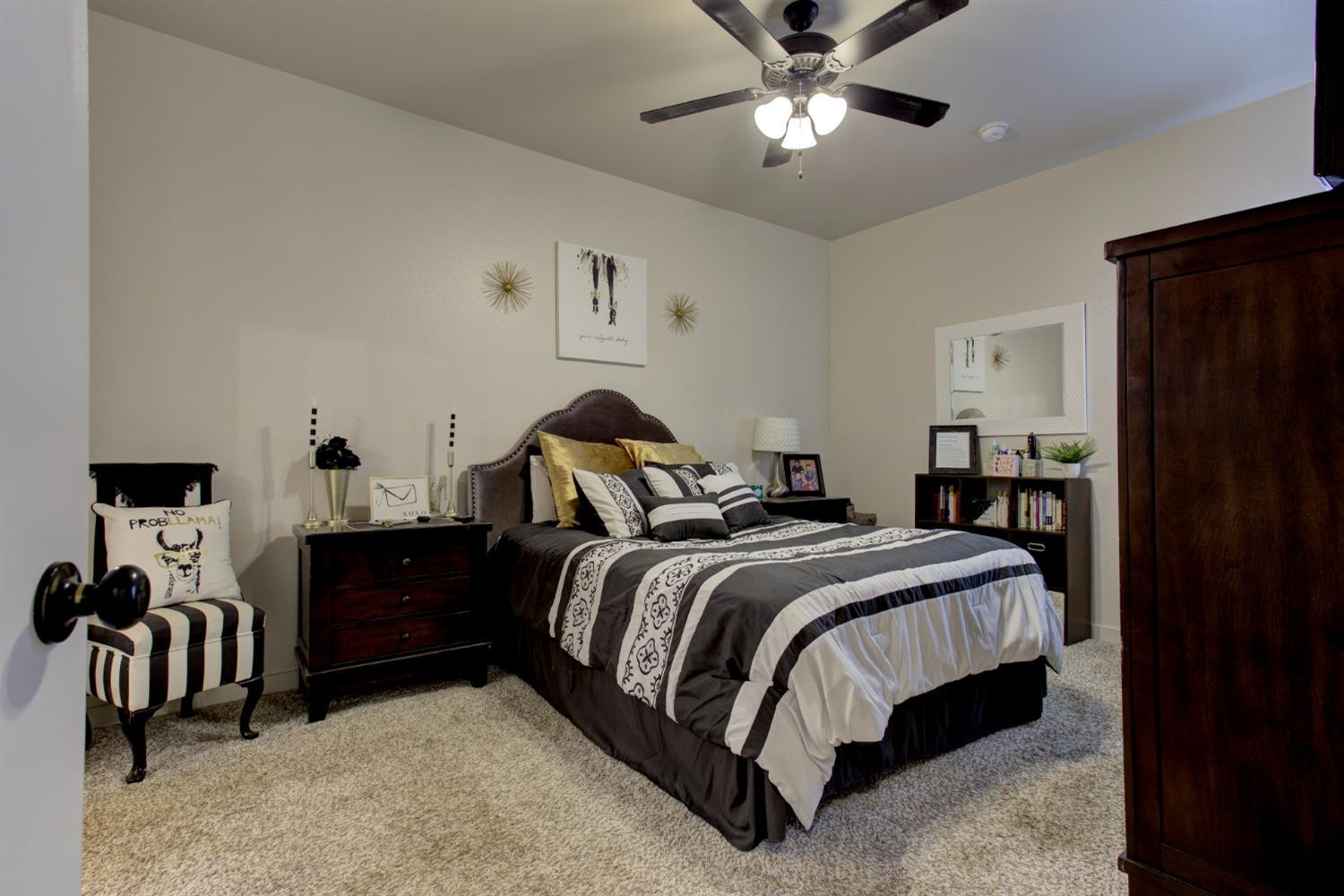 2721 137th Street Lubbock, TX 79423 - Photo 6 of 30 a spacious bedroom with a bed and a chandelier