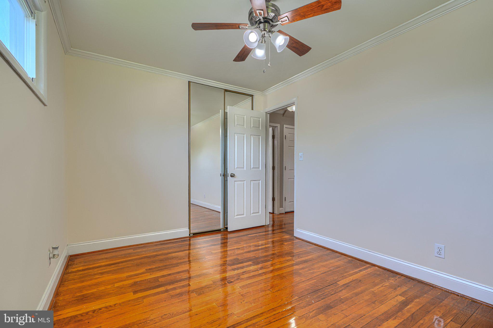3708 Cassen Road Randallstown, MD 21133 - Photo 15 of 38 a view of empty room with wooden floor