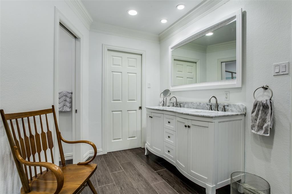 8619 Angora Street Dallas, TX 75218 - Photo 17 of 24 Bathroom with ornamental molding, wood-type flooring, and double sink vanity