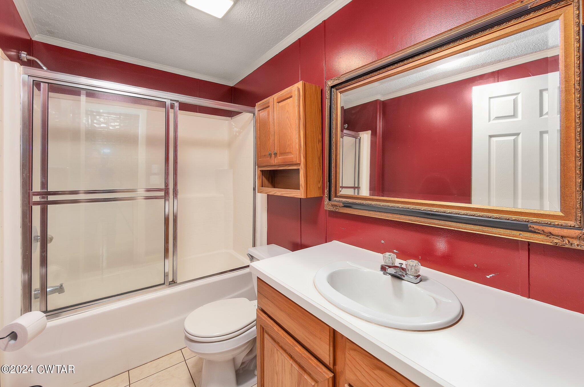 1645 Hopewell Road Lavinia, TN 38348 - Photo 15 of 16 a bathroom with a sink toilet and shower