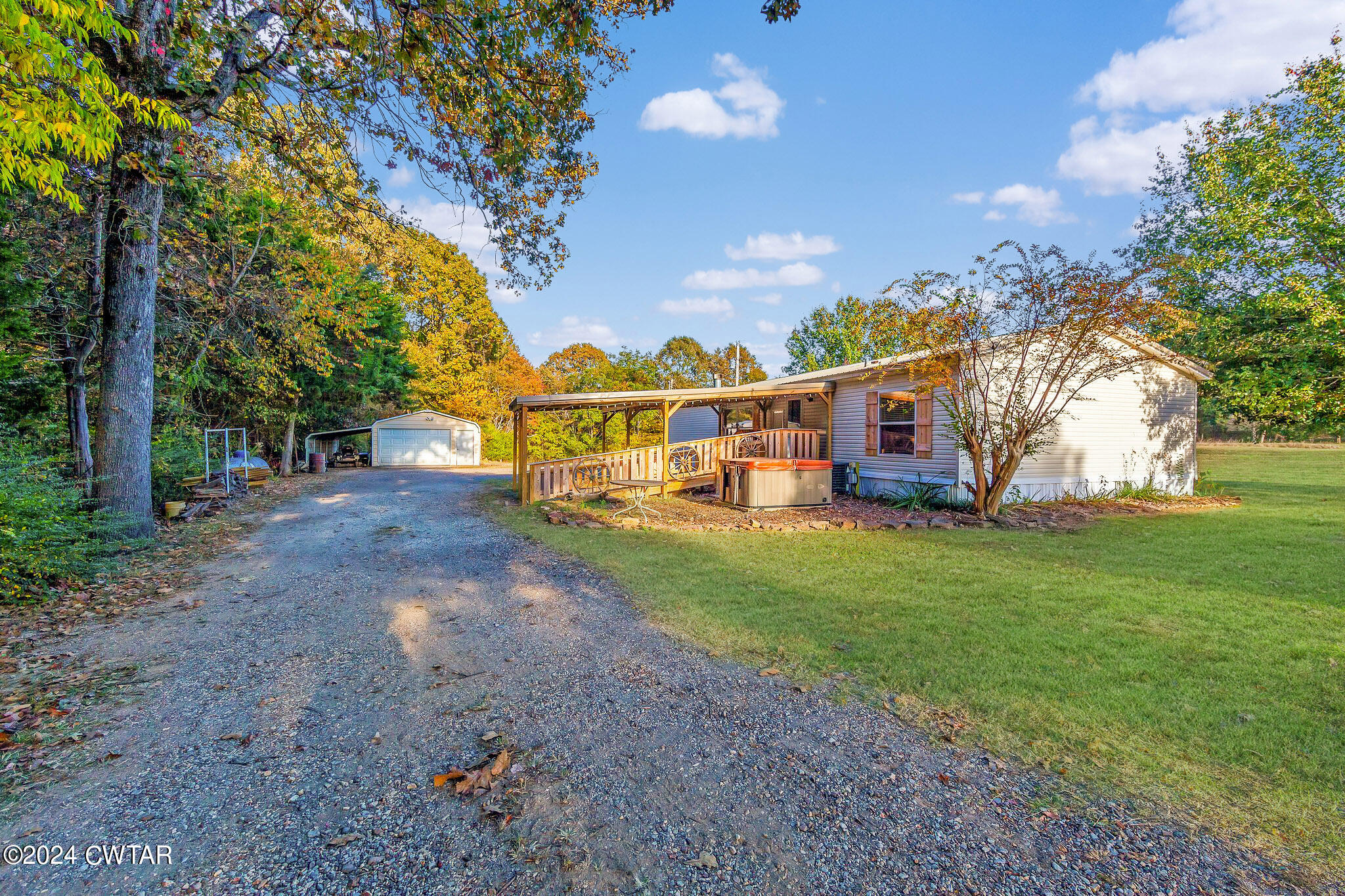 1645 Hopewell Road Lavinia, TN 38348 - Photo 2 of 16 a view of a house with a yard