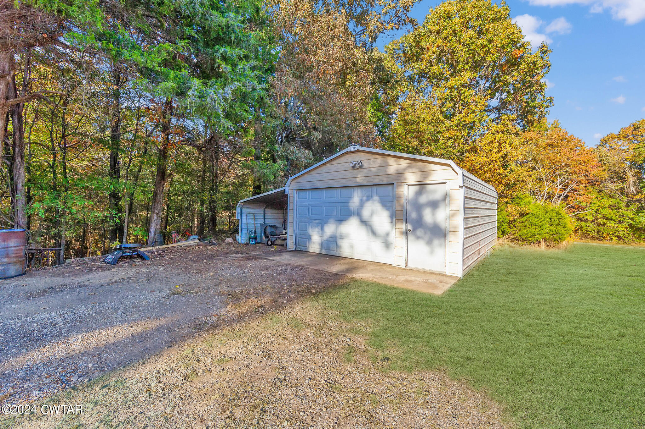 1645 Hopewell Road Lavinia, TN 38348 - Photo 4 of 16 a view of a tiny house with a yard