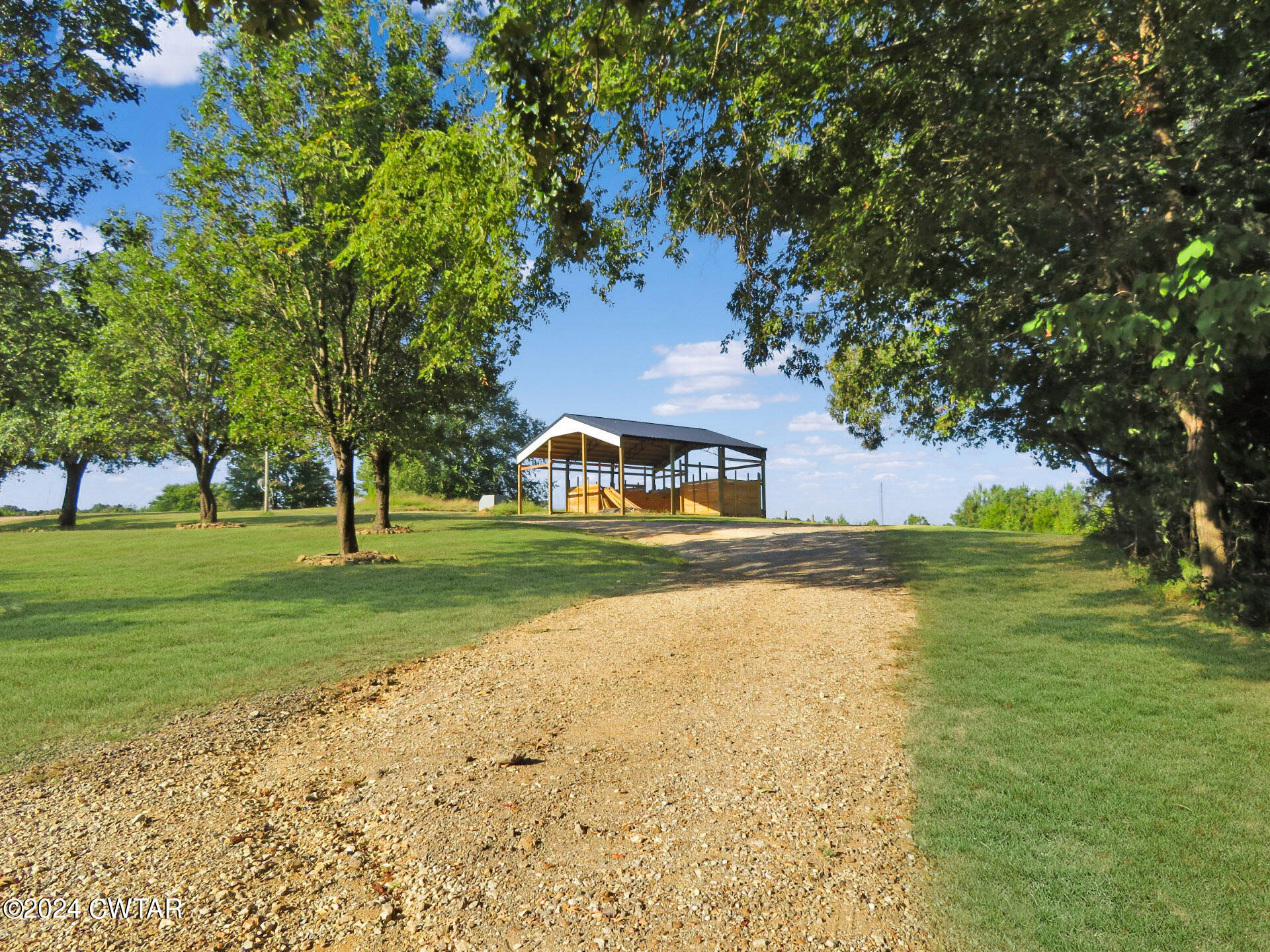 1645 Hopewell Road Lavinia, TN 38348 - Photo 5 of 16 a view of a house with a yard