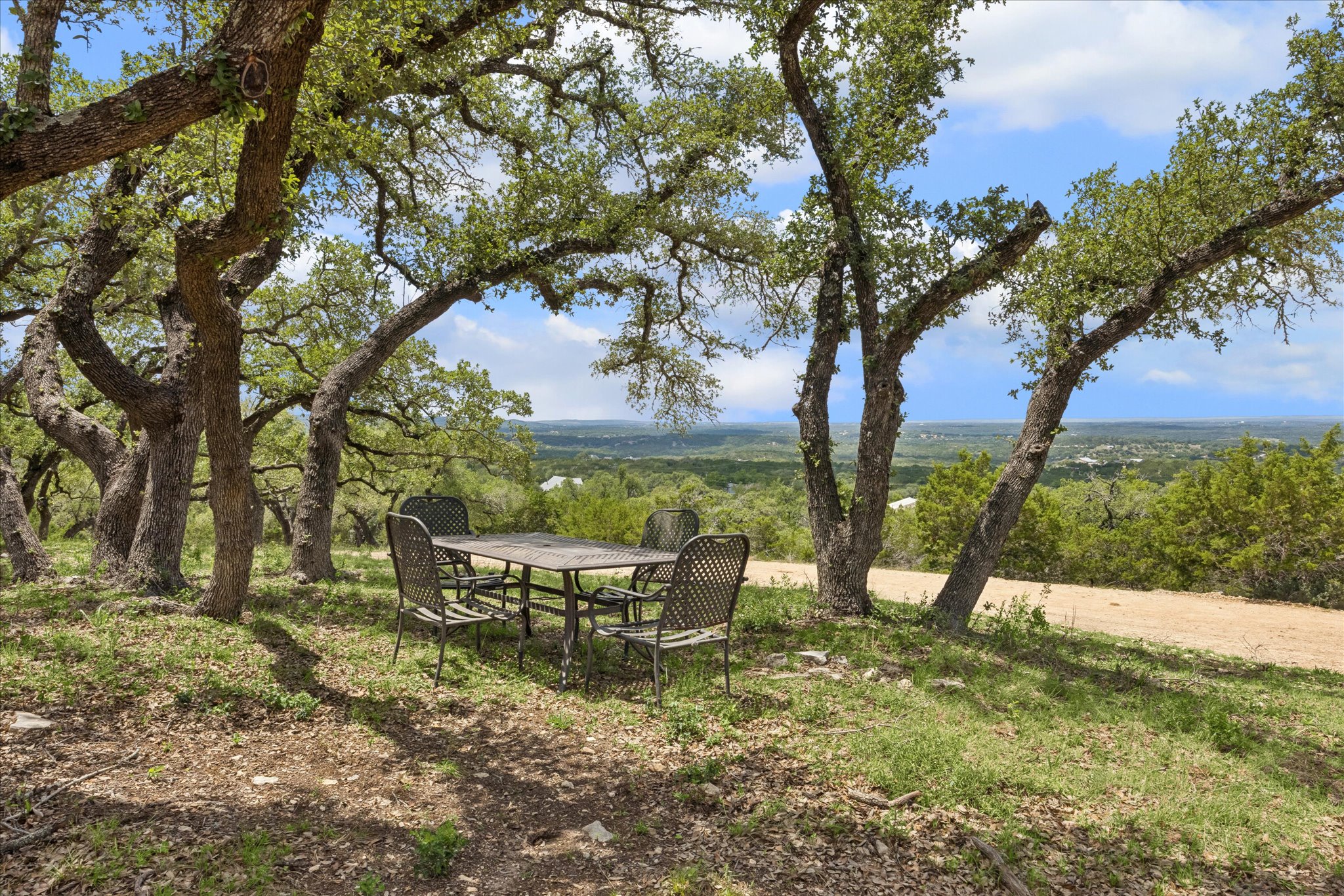 6411 West Fitzhugh Road Dripping Springs, TX 78620 - Photo 24 of 34 Expansive outdoor setting featuring mature trees providing natural canopy