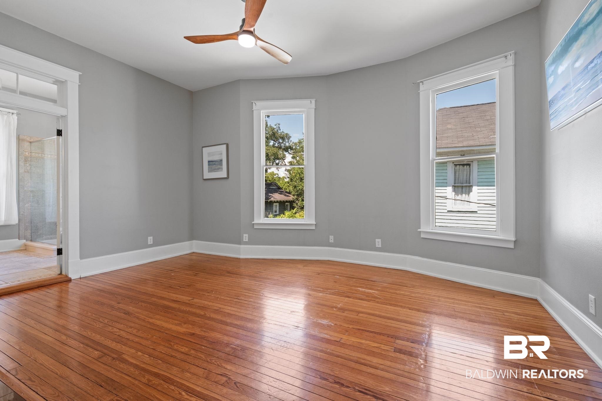 10 South Monterey Street Mobile, AL 36604 - Photo 21 of 45 Empty room with light wood-style floors and healthy amount of natural light
