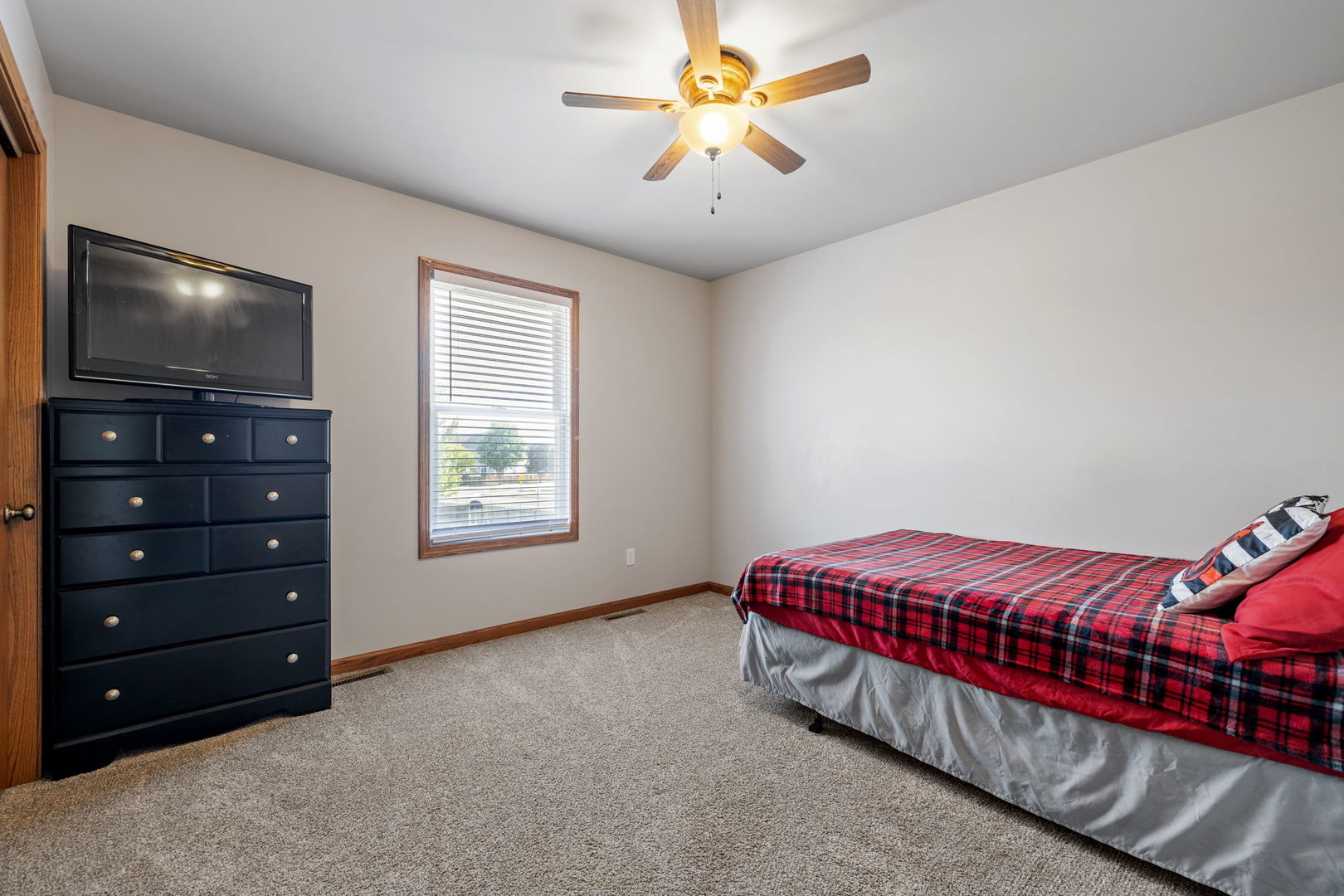1932 Taller Road Morris, IL 60450 - Photo 20 of 34 a bedroom with a bed and a flat screen tv