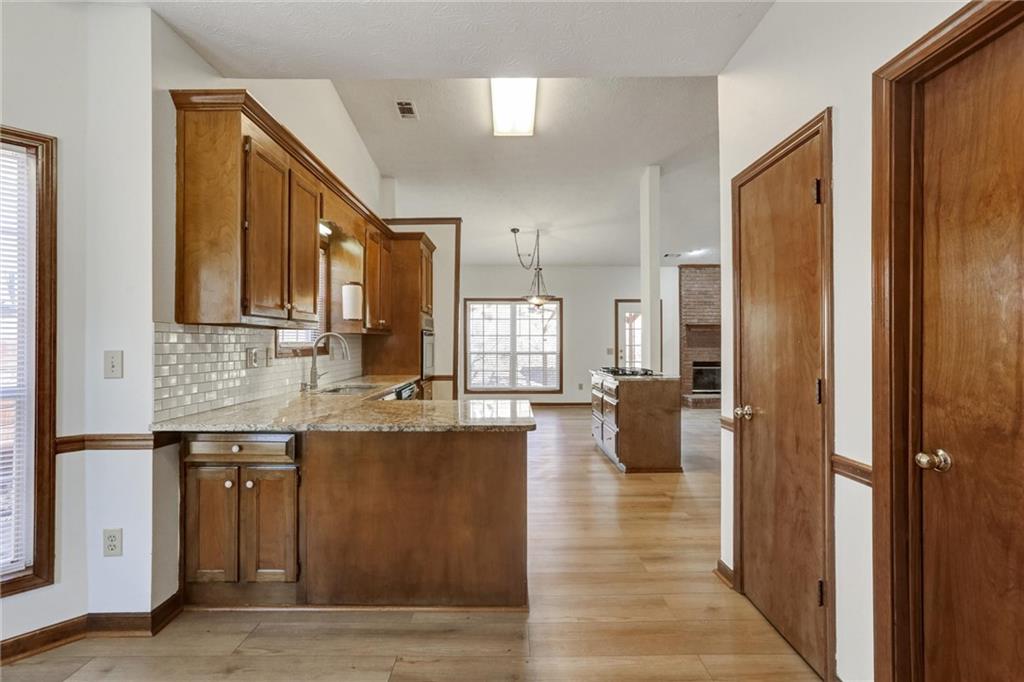 487 Ravinia Way Lawrenceville, GA 30044 - Photo 17 of 45 a bathroom with a granite countertop sink a mirror and shower