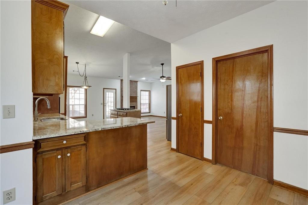 487 Ravinia Way Lawrenceville, GA 30044 - Photo 18 of 45 a large kitchen with a sink and refrigerator