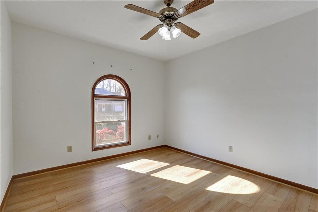 487 Ravinia Way Lawrenceville, GA 30044 - Photo 19 of 45 an empty room with windows