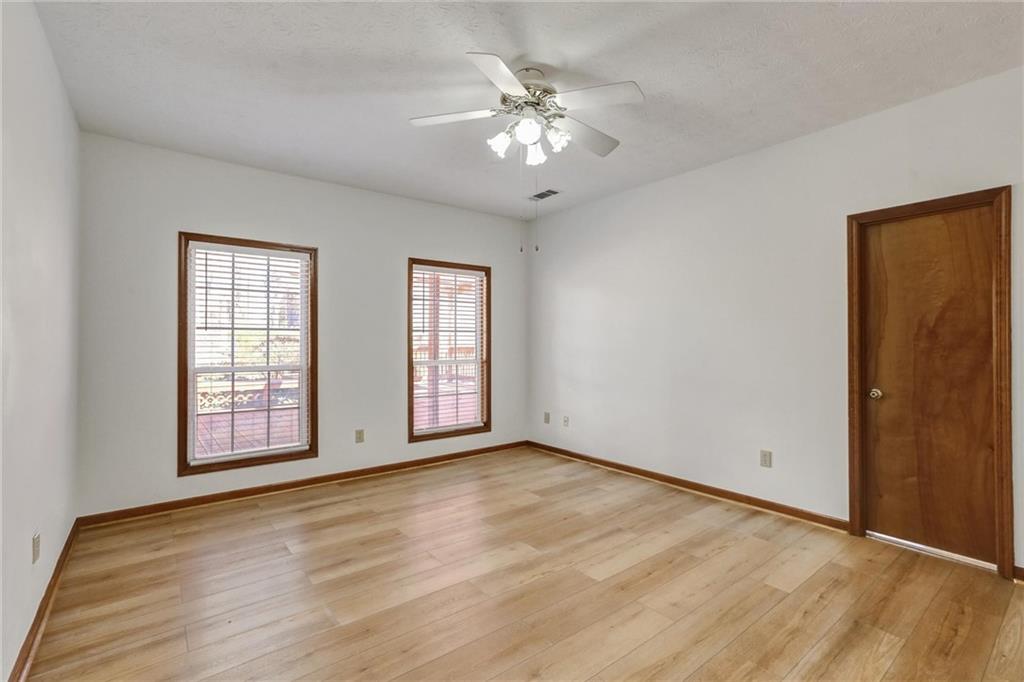 487 Ravinia Way Lawrenceville, GA 30044 - Photo 25 of 45 a view of an empty room with a window