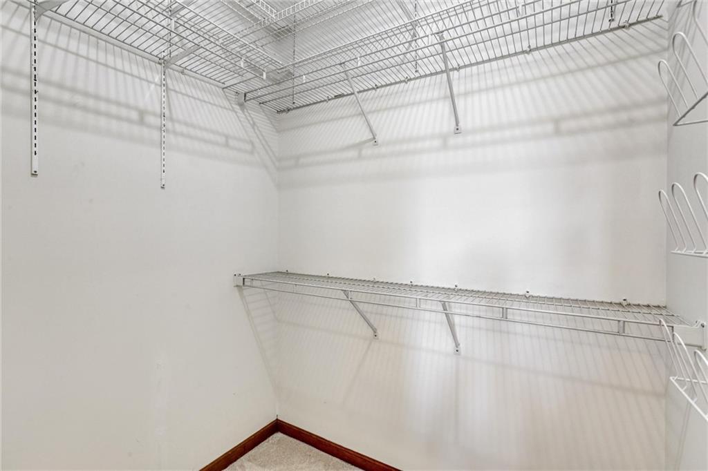 487 Ravinia Way Lawrenceville, GA 30044 - Photo 33 of 45 a view of a room with racks on the wall