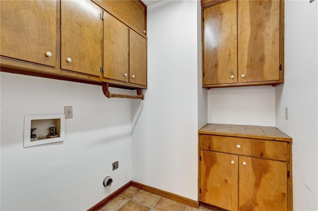487 Ravinia Way Lawrenceville, GA 30044 - Photo 34 of 45 a view of a storage and utility room with washer and dryer