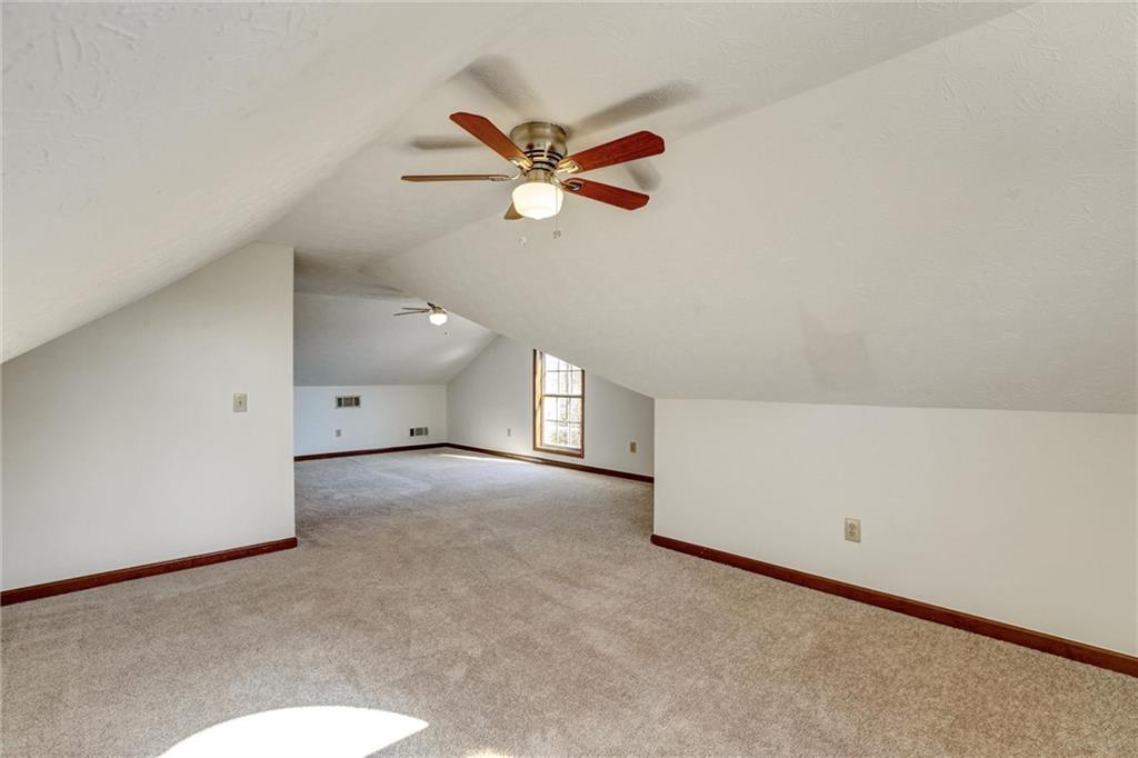 487 Ravinia Way Lawrenceville, GA 30044 - Photo 36 of 45 a view of a livingroom with a ceiling fan and window