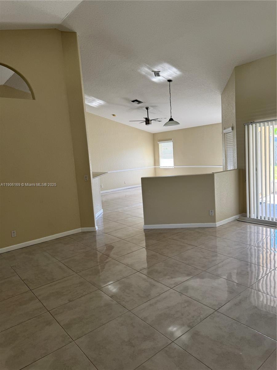 726 Southwest McCracken Avenue Port St. Lucie, FL 34953 - Photo 3 of 10 a view of a livingroom with a staircase
