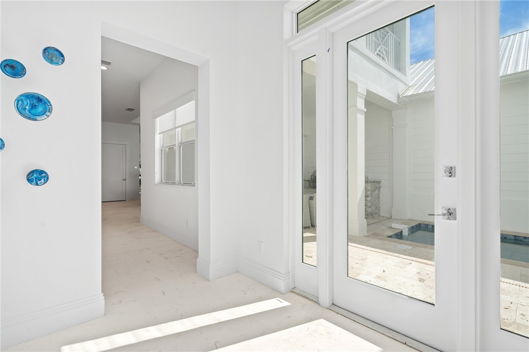 20 Strand Drive Vero Beach, FL 32963 - Photo 16 of 36 a bathroom with a glass shower door