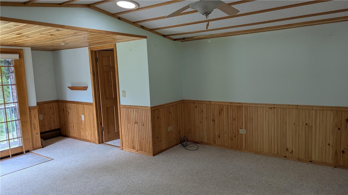 683 Lower 3rd Brook Road Walton, NY 13856 - Photo 8 of 27 Living room has vaulted ceilings, Atrium door giving access to back yard. Neutral colors thru out.