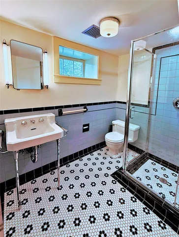 a view of house with swimming pool and outdoor seating