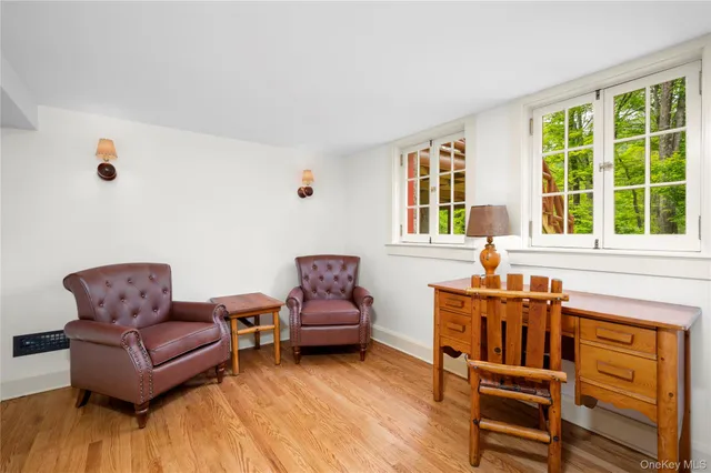 a view of a house with a yard from a lake view