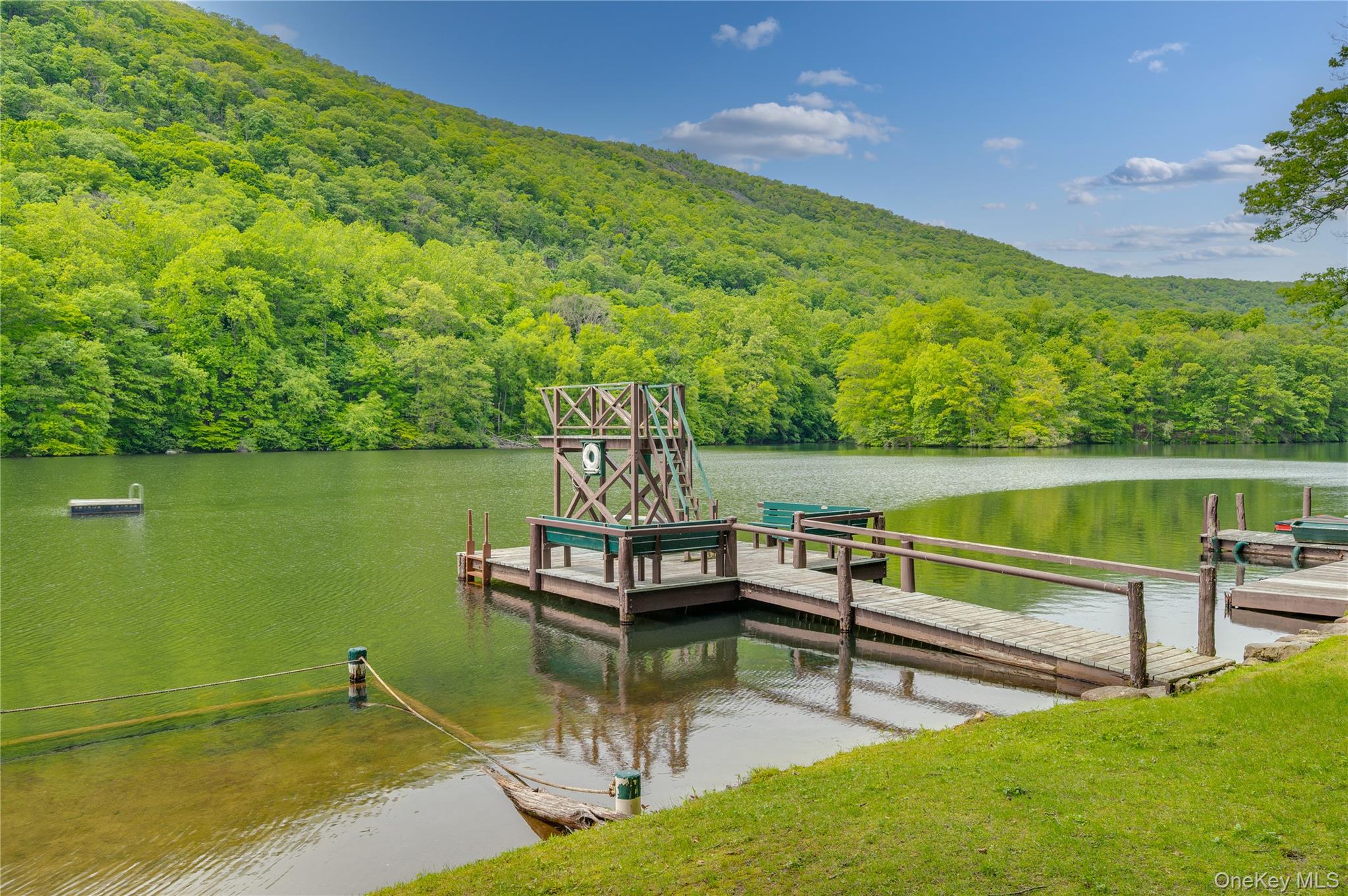 16 Locust Drive Cold Spring, NY 10516 - Photo 36 of 50 a view of a lake with couches and wooden floor