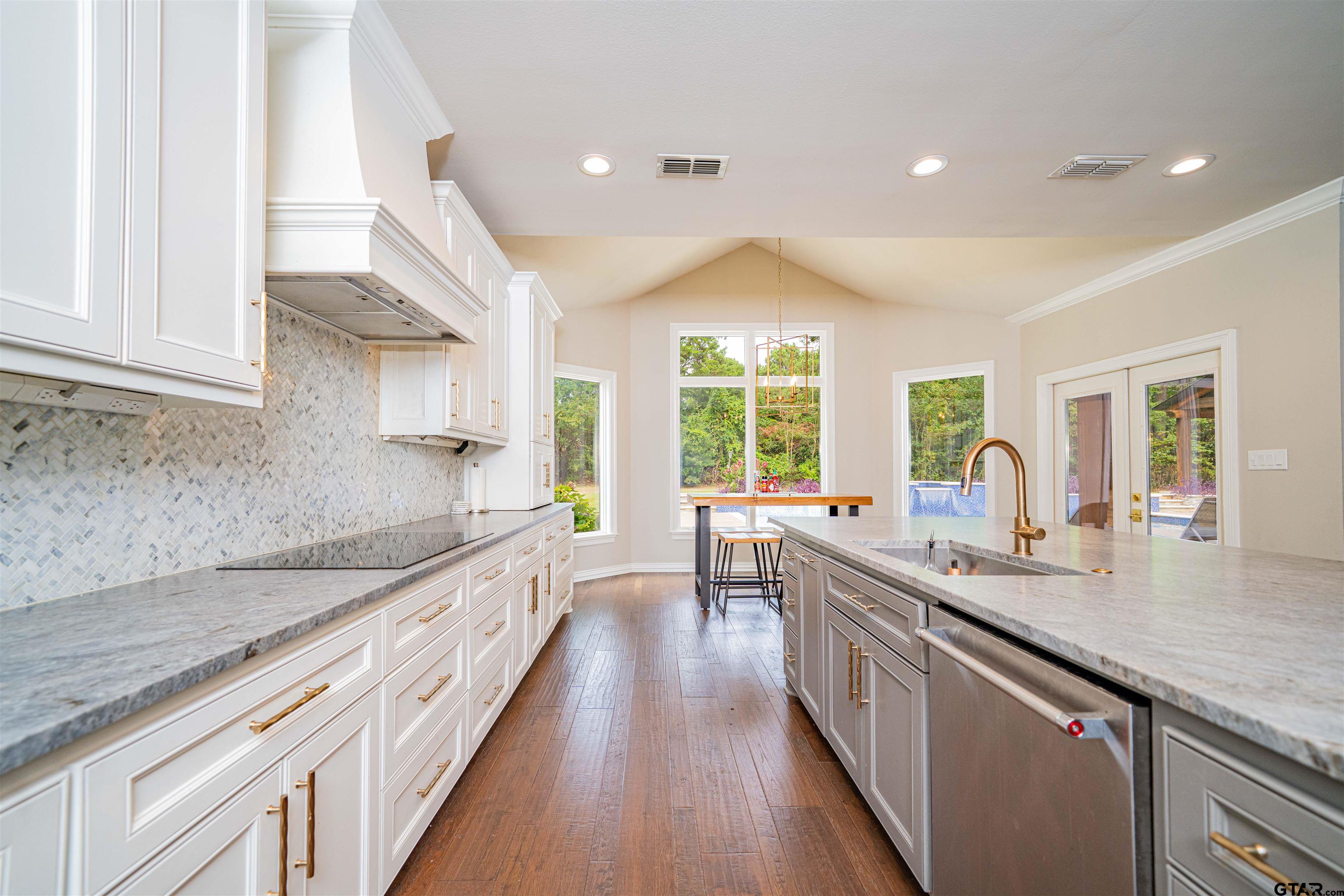 219 Hunters Circle Longview, TX 75605 - Photo 12 of 47 a kitchen with sink stove and cabinets
