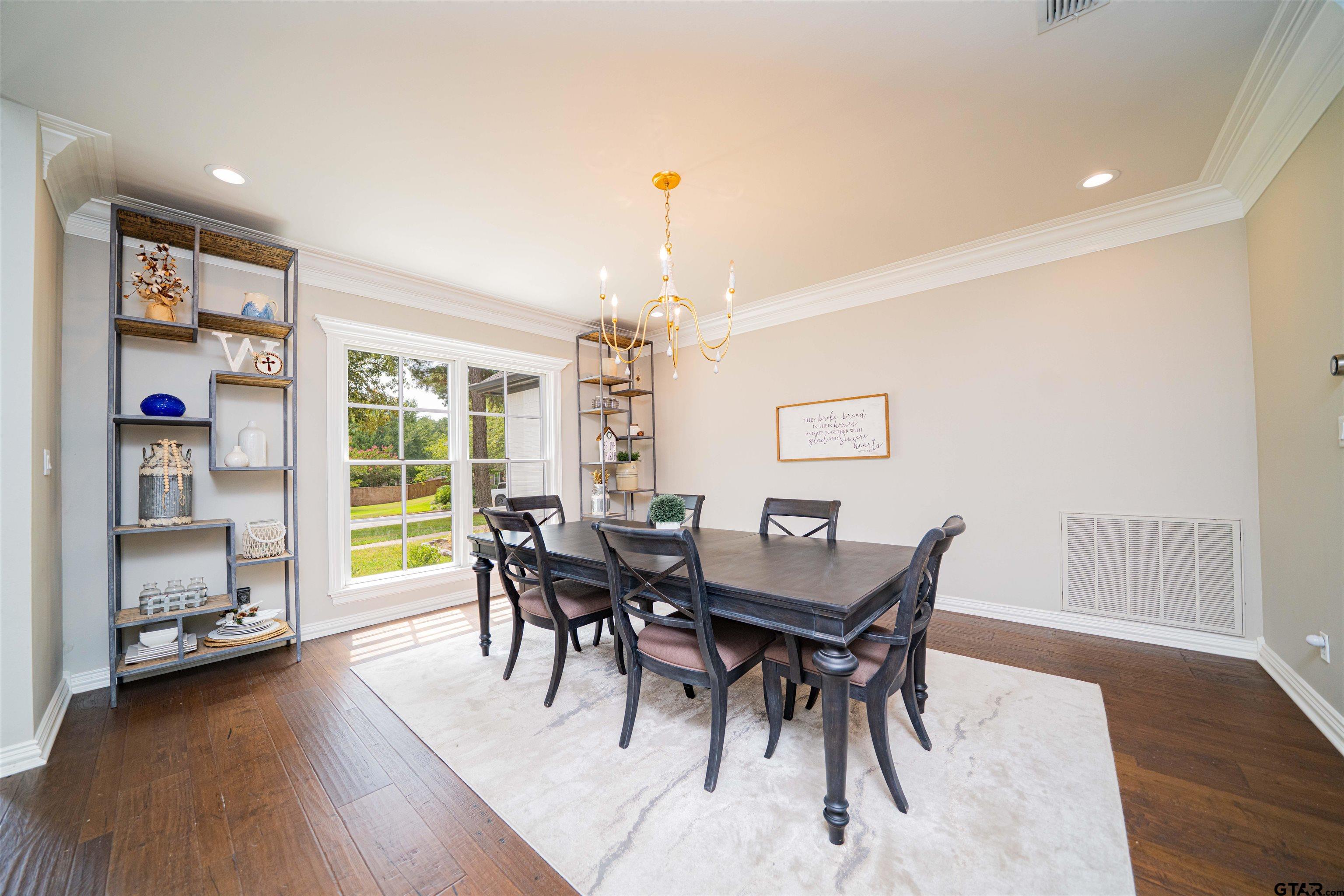 219 Hunters Circle Longview, TX 75605 - Photo 13 of 47 a view of a dining room with furniture and wooden floor