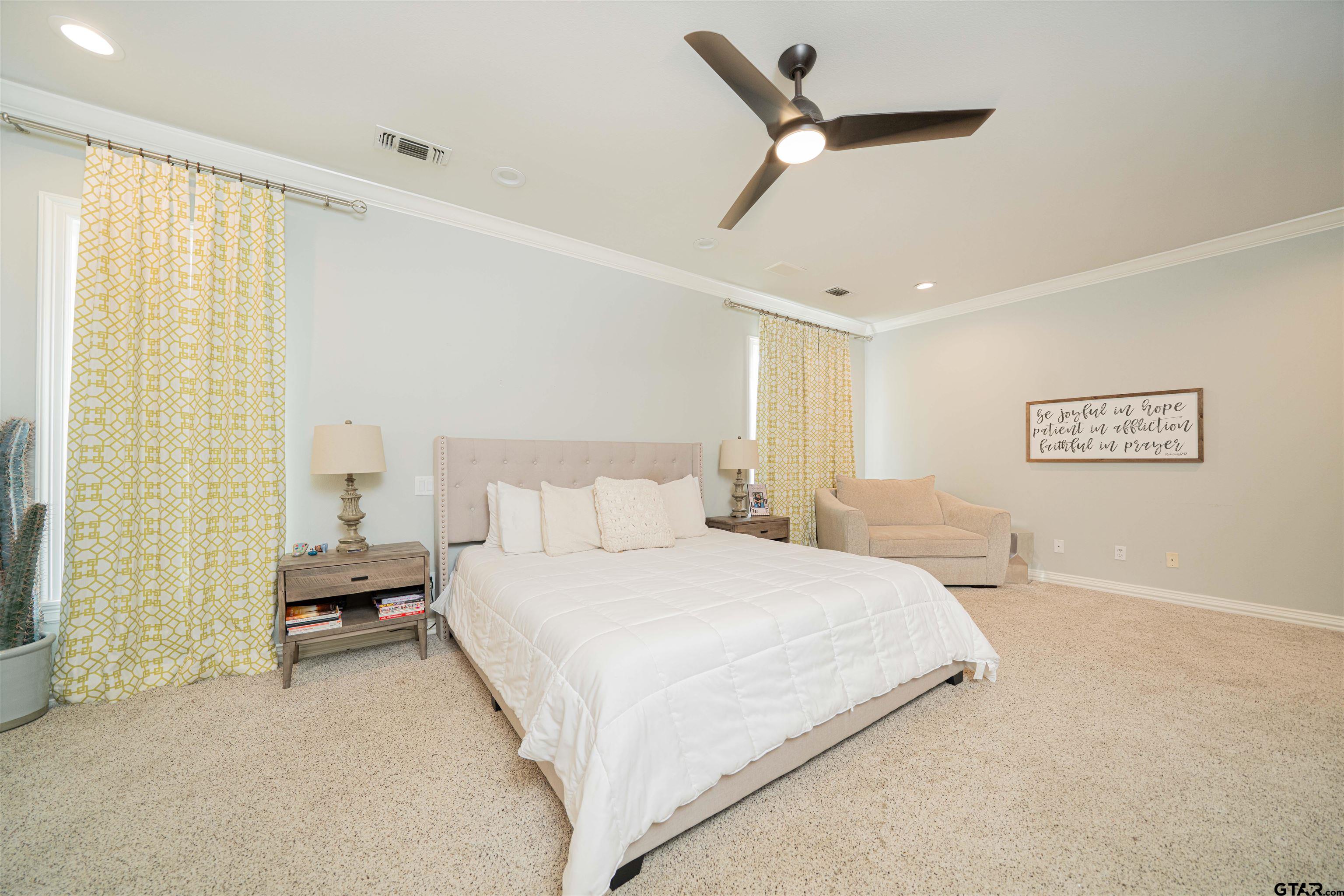 219 Hunters Circle Longview, TX 75605 - Photo 15 of 47 a bedroom with a bed and a walk in closet