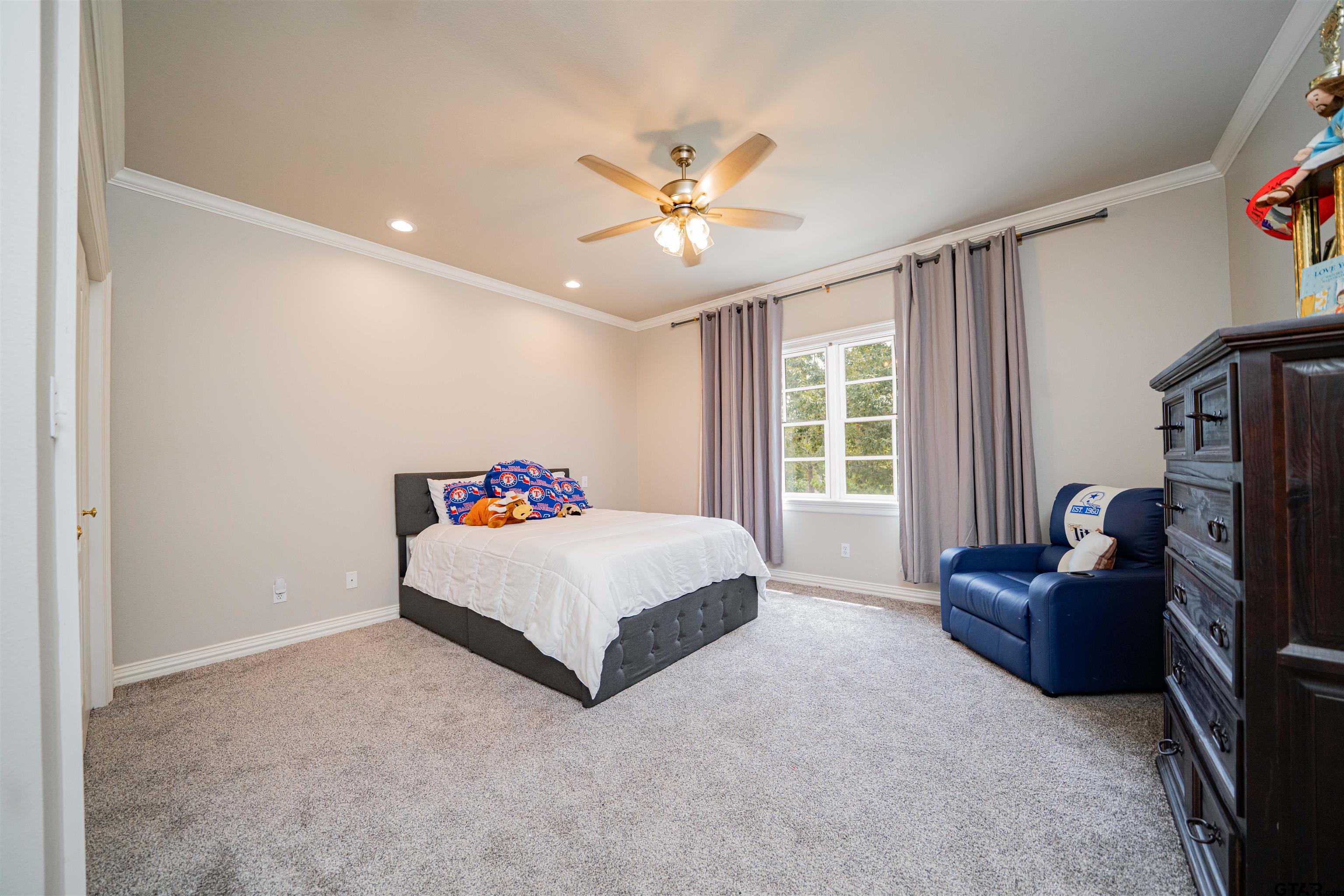 219 Hunters Circle Longview, TX 75605 - Photo 20 of 47 a room with a bed furniture and a window