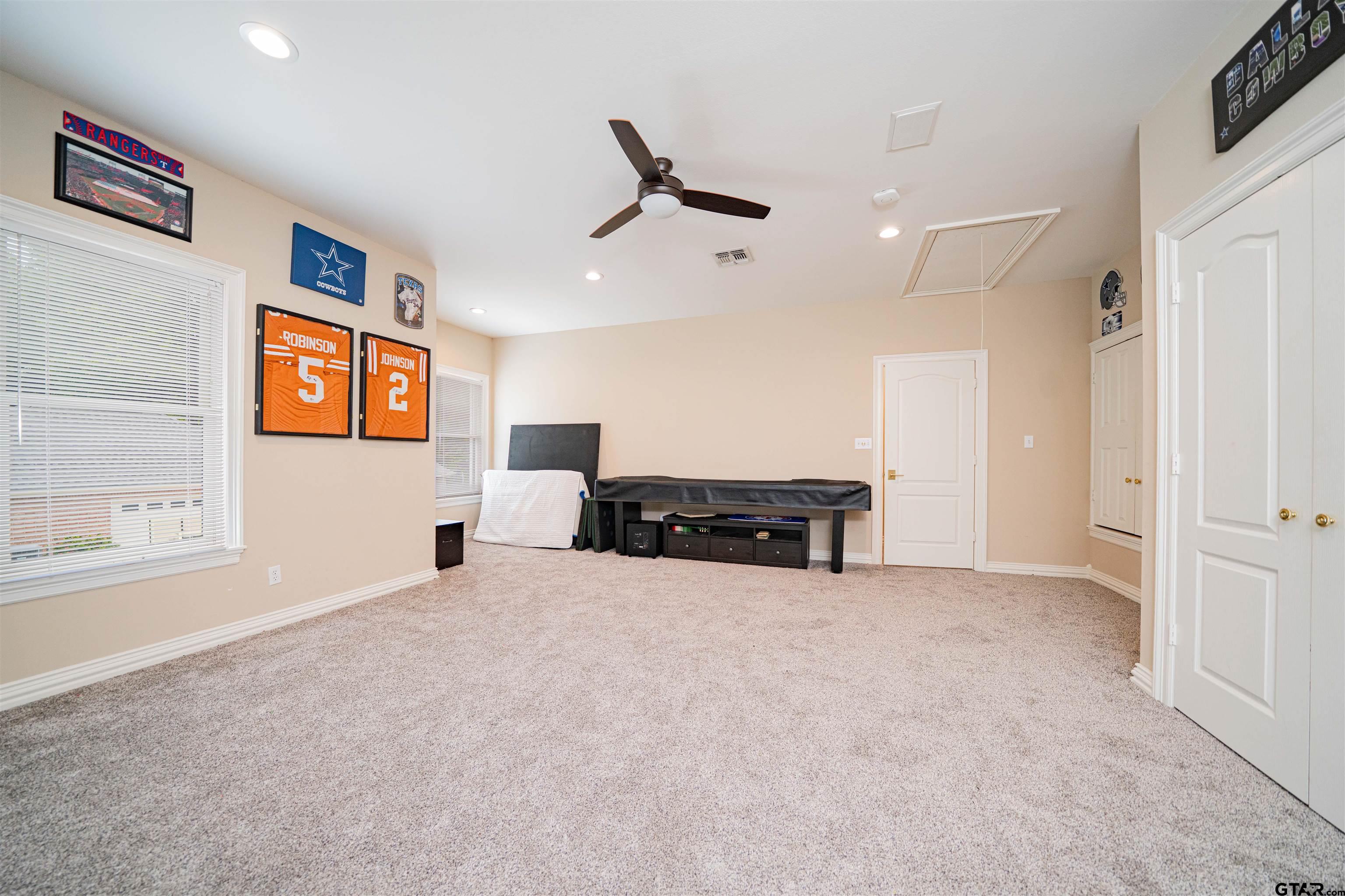 219 Hunters Circle Longview, TX 75605 - Photo 24 of 47 an empty room with windows and ceiling fan