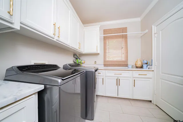 a white toilet sitting next to a bathroom sink