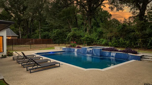 a view of a patio with a table and chairs