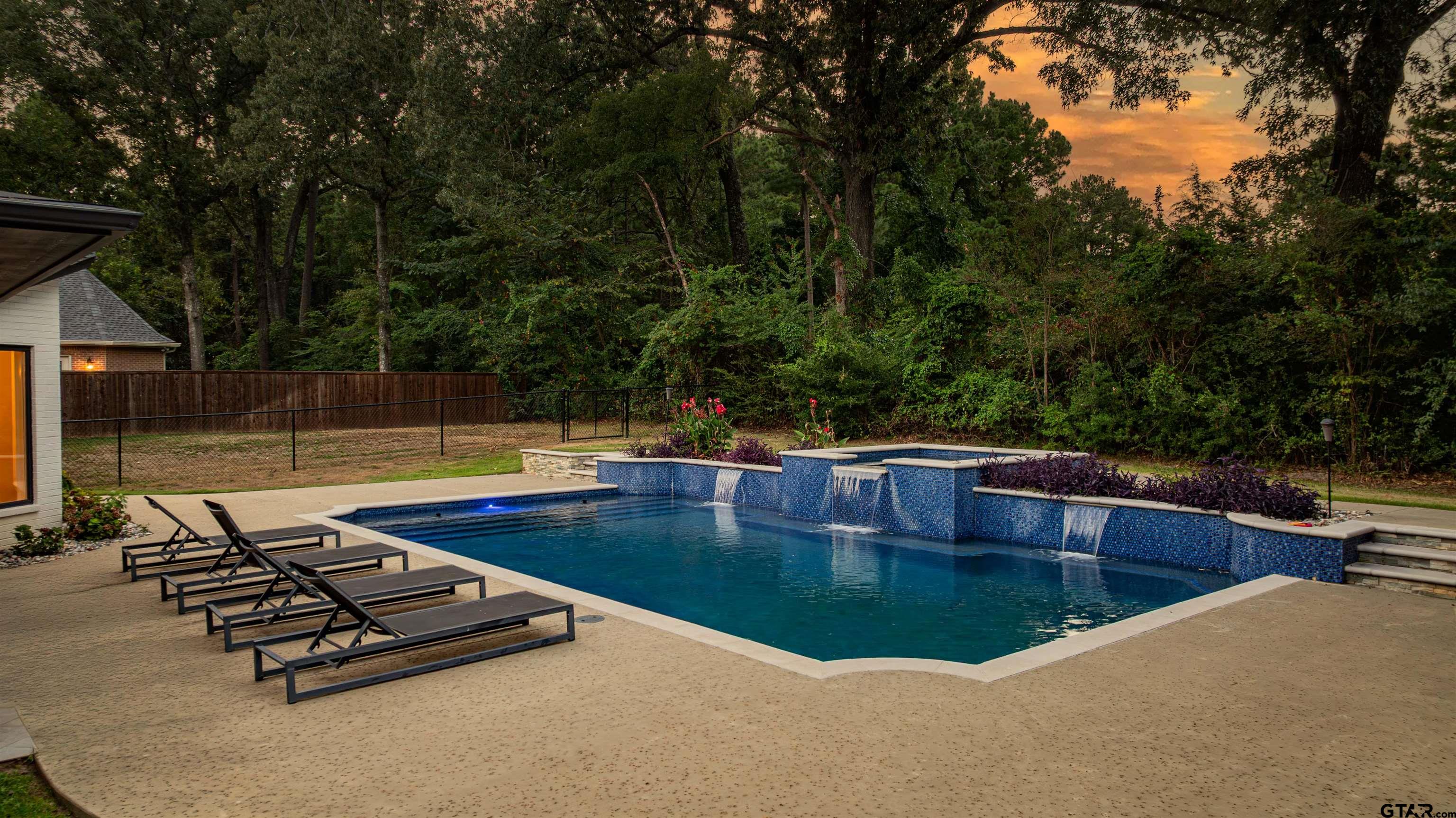 219 Hunters Circle Longview, TX 75605 - Photo 30 of 47 a view of a swimming pool with lounge chair