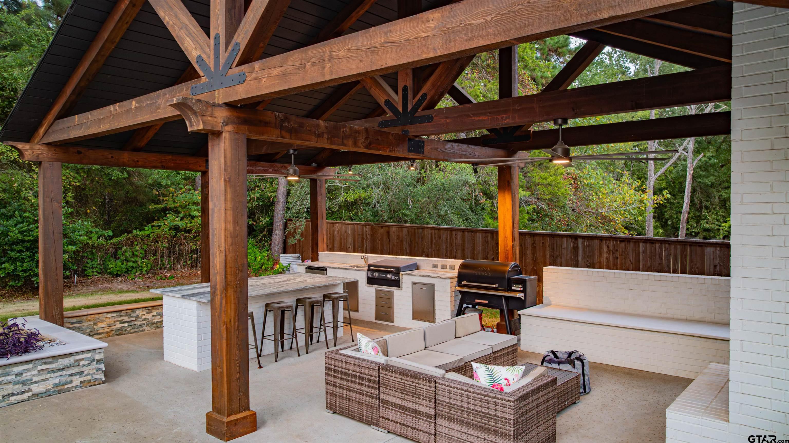 219 Hunters Circle Longview, TX 75605 - Photo 31 of 47 a view of a patio with a table and chairs