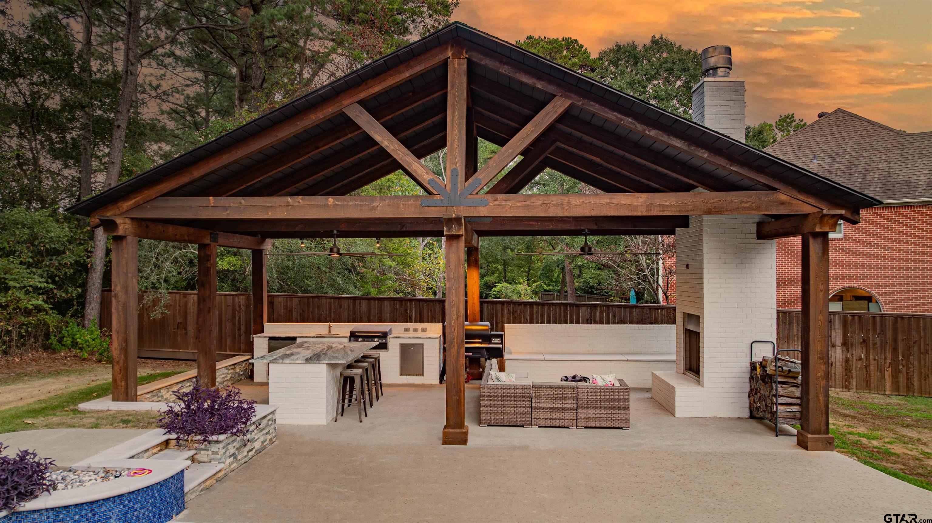 219 Hunters Circle Longview, TX 75605 - Photo 32 of 47 a patio with table and chairs