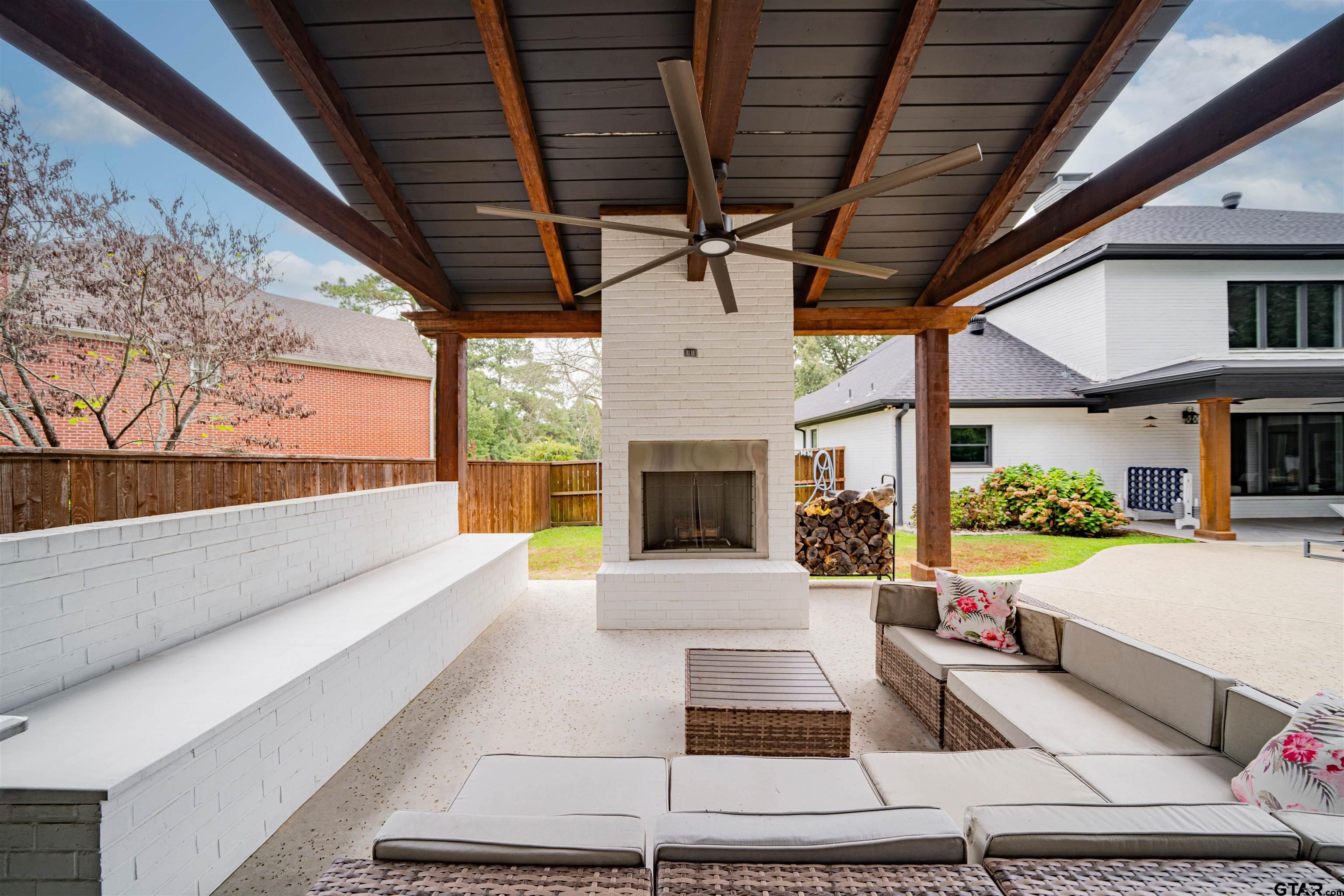 219 Hunters Circle Longview, TX 75605 - Photo 41 of 47 a building outdoor space with patio furniture and a fireplace