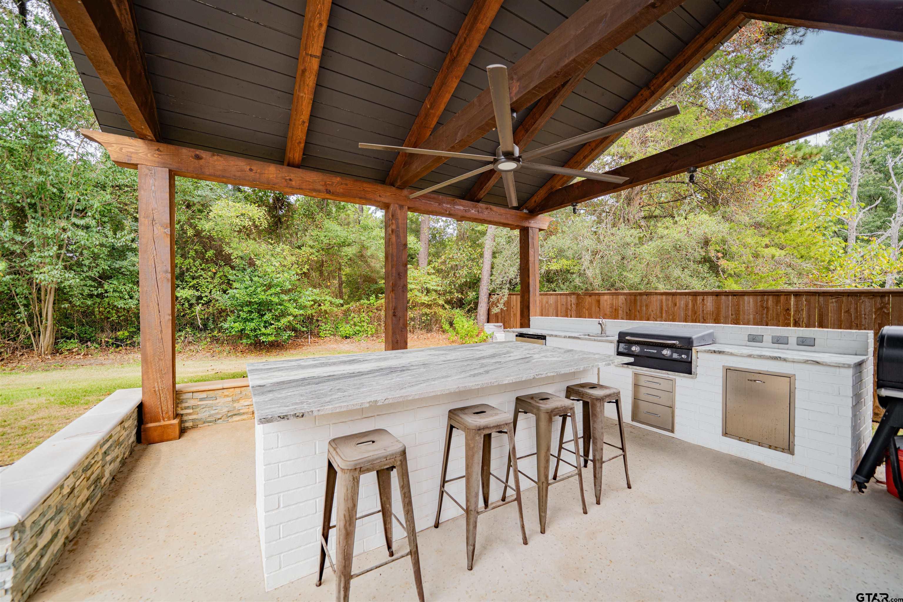 219 Hunters Circle Longview, TX 75605 - Photo 42 of 47 a kitchen view with a stove and chairs