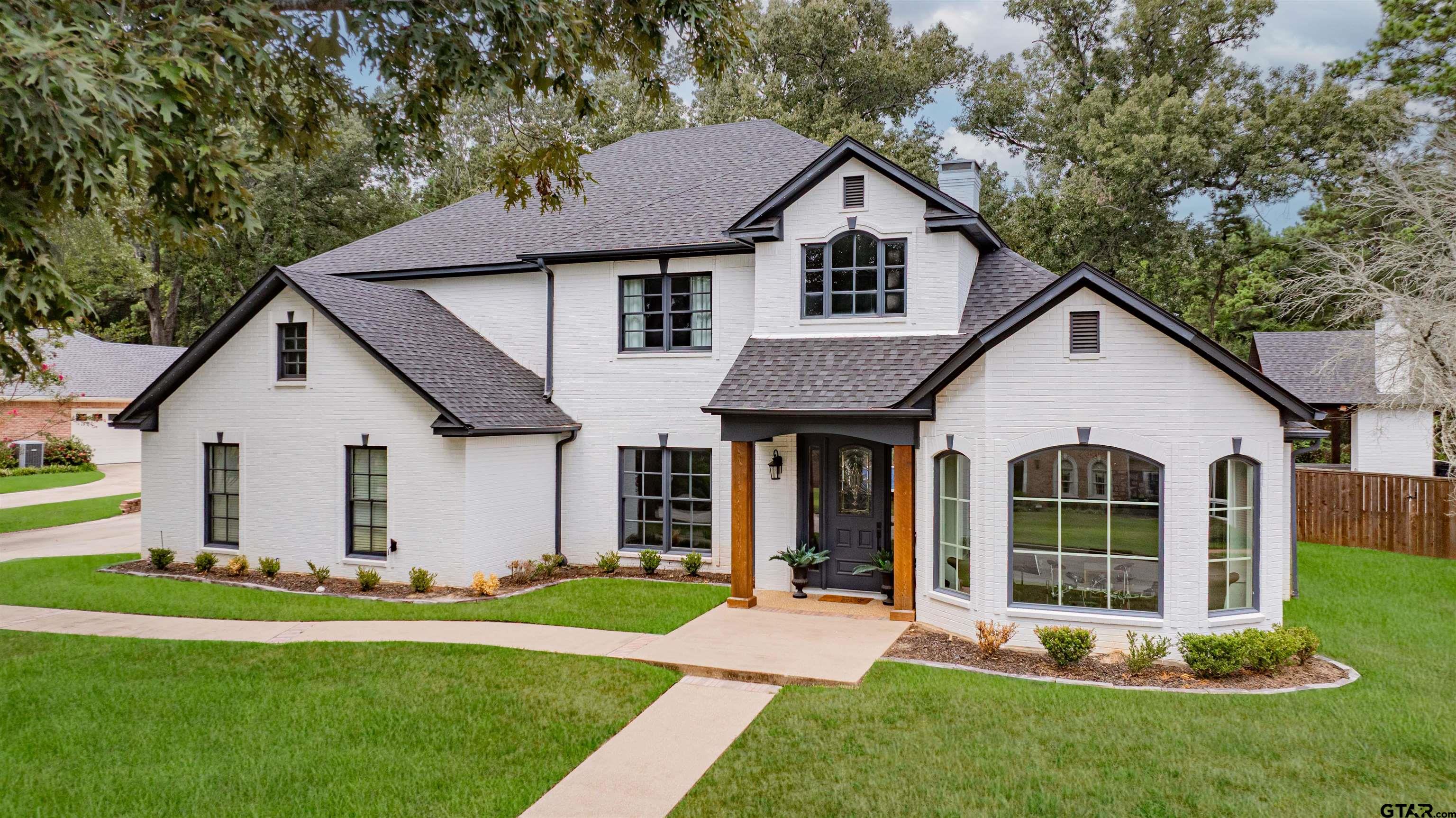 219 Hunters Circle Longview, TX 75605 - Photo 45 of 47 a view of a yard in front of a house with plants and large tree