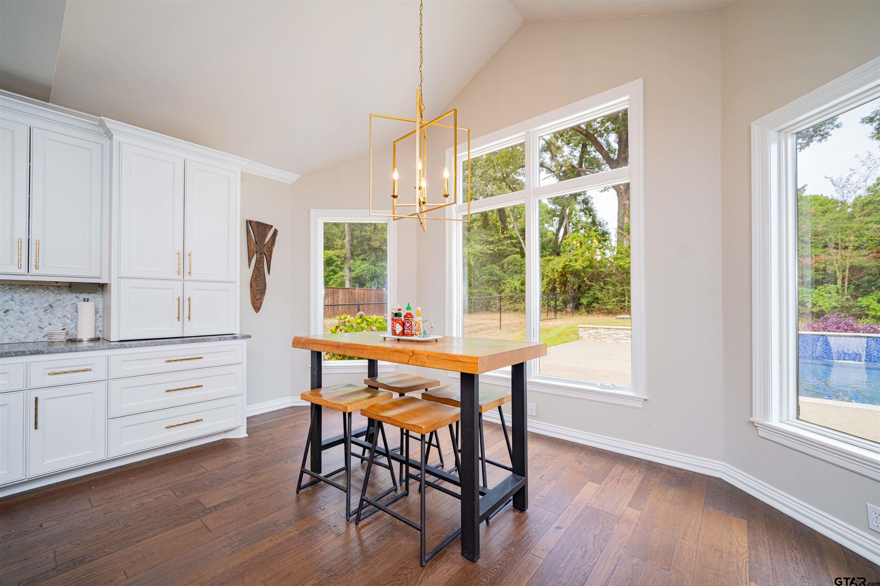 219 Hunters Circle Longview, TX 75605 - Photo 10 of 47 a view of a dining room with furniture window and wooden floor