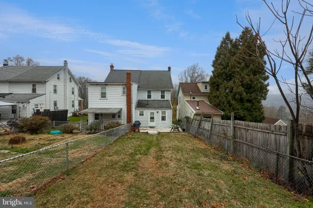 a view of a room with windows and couch
