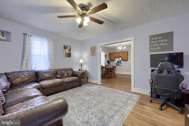 a room with furniture and wooden floor