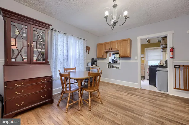 a kitchen with refrigerator and window