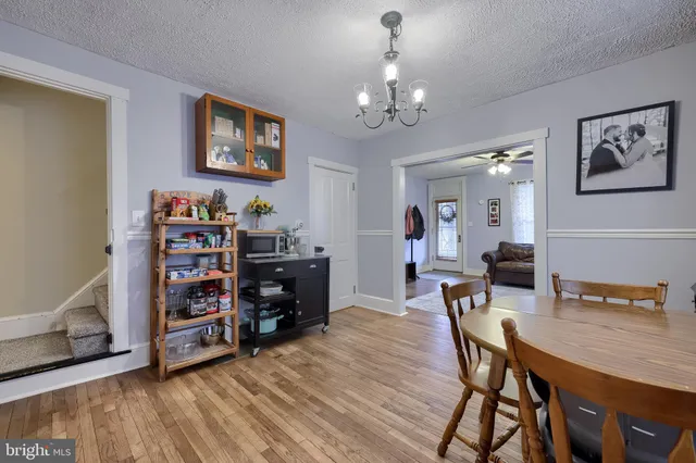 a white toilet sitting next to a bathroom sink and a shower