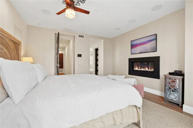a bedroom with a bed and a fireplace